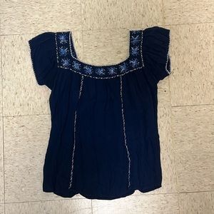 patterned blue blouse